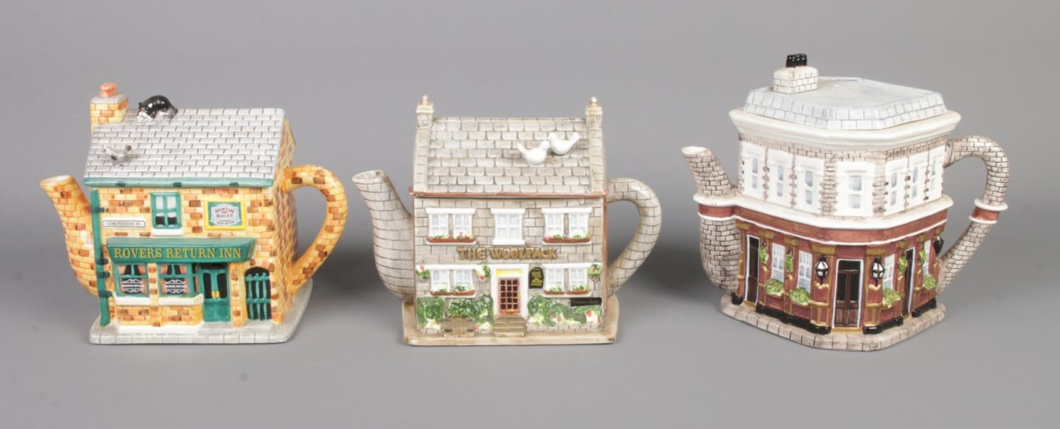 Three Annie Rowe soap opera pubs ceramic tea pots. Comprises of The Queen Victoria, Rovers Return