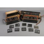 Four cases of magic lantern slides depicting assorted photographs including British Abbeys,