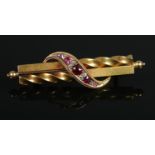 A Victorian 15ct gold, ruby and diamond brooch. 5.5cm.