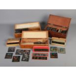 Three cases of coloured magic lantern slides including several sets such as The Transvaal War and