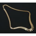 A 9ct gold graduated necklace. Each panel with textured and bright cut engraving. Import mark for