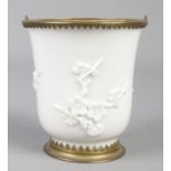 An 18th century blanc de chine beaker sprigged with prunus blossom decoration and having gilt