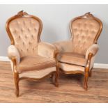 A pair of French style hardwood arm chairs with deep button backs.