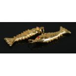 Two yellow metal articulated fish pendants, both set with red coloured stone eyes. Length 3cm. 1.
