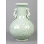 A large 20th century celadon vase with twin loop handles. Longquan marks to base. Height 32cm.