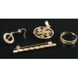 Four pieces of 9ct gold jewellery. Includes rope twist bar brooch, star pendant, ring and one