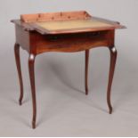 An early 20th century Stone's Patent mahogany writing table with pop up interior. Height 74cm, Width