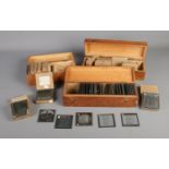 Three cases of Magic Lantern slides of a mostly religious theme including several boxed sets such as