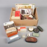 A collection of assorted gramophone accessories including needle sharpeners, brushes, pressure