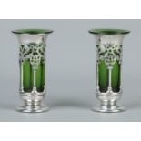 A pair of Edwardian pierced silver vases with green glass liners. Weighted bases. Assayed Birmingham