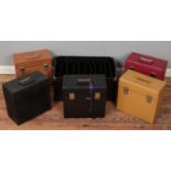 Five empty record carry cases along with a similar box.