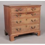 A Georgian mahogany chest of two over three drawers raised on ogee bracket feet. Height 81cm,