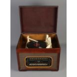 A McCarthy vintage radio in mahogany case with Monarch BSR cream bakelite record player fitted to
