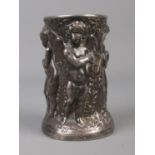 A late 19th/early 20th century white metal brush pot. Decorated in relief with cherubs. Stamped Dini