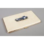 A vintage cigarette case embossed with 1957 Le Mans winning No.3 D-type Jaguar and Ecurie Ecosse