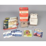 A collection of View-Master stereo viewers including Talking View Master and 3D Immersion along with