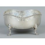 A George V pierced silver bowl raised on four scrolled feet. Assayed Sheffield 1920 by Walker &