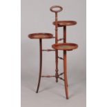 An Edwardian mahogany three tier cake stand, with satinwood crossbanding and turned supports. Height