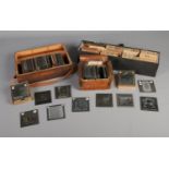 Three cases of magic lantern slides with a mostly religious theme including several sets such as