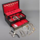 A cantilever jewellery box and contents. Includes rolled gold and paste set ring, yellow metal &