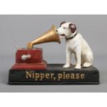 A cast iron musical figure formed as the His Master's Voice dog and gramophone with moving jaw and