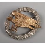 A WWII Third Reich Fallschirmjaeger Luftwaffe Paratrooper badge stamped with G.H Osang Dresden