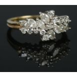 An 18ct gold ring set with marquise and brilliant cut diamonds. London import marks. Size P. 5.08g.