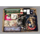 A tray of costume jewellery. Includes paste set brooches, sapphire 'sample' ring, bangles,