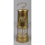 A brass miners safety lamp bearing Welsh Dragon insignia, Cymru.