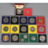 A quantity of mostly cased crown coins. Includes commemorative examples, etc.