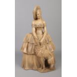A large terracotta figure of a lady in period dress with dog. Height 40cm. Chip to base of dress.