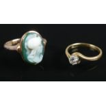 Two 9ct gold rings. Includes one diamond example and the other cameo example. 4.98g gross.