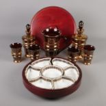 A collection of decorative drinking glassware along with a mahogany 'Lazy Susan' with fitted ceramic