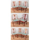 A set of eight Chinese hardwood dining chairs with carved detailing to back splat. Includes two