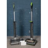 Two Gtech AirRam vacuum cleaners, with chargers and filter kit.