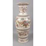 A decorative ceramic floor vase decorated with floral motifs. Approx. height 80cm.