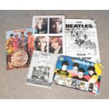A Collection of 5 posters of The Beatles including promotional posters for Revolver and Sgt