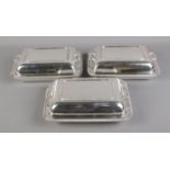 Three Harrison Brothers and Howson silver plate rectangular tureens.