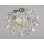 Approx. 30 costume jewellery brooches including elf, floral and Avon examples.