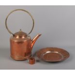 A collection of copper including kettle, hammered tray and miniature jug.