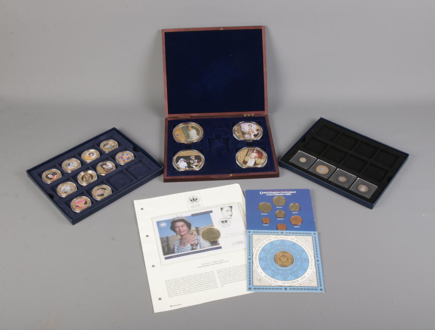 A collection of Westminster Collection and Windsor Mint coins and cases as well as other