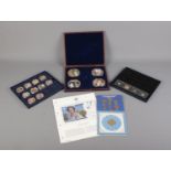 A collection of Westminster Collection and Windsor Mint coins and cases as well as other