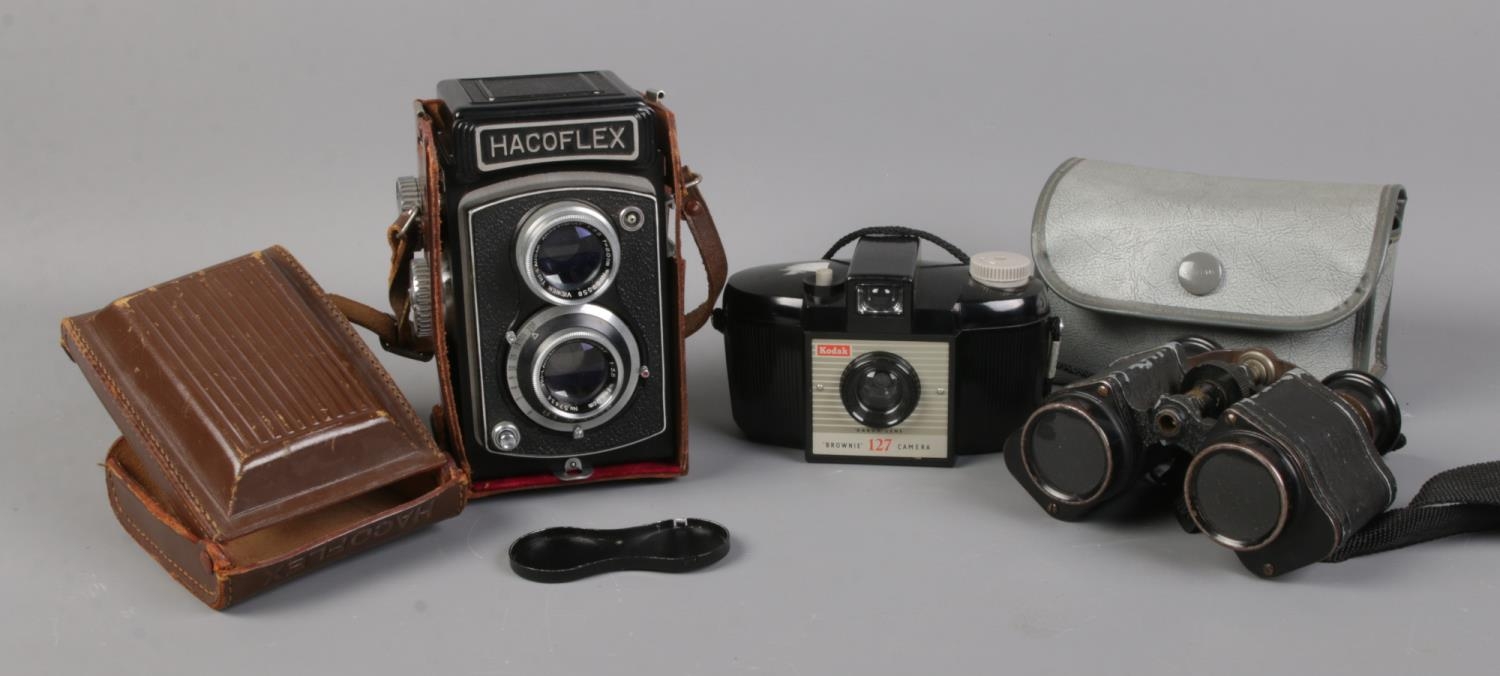 A cased Hacoflex camera, with Anastigmat lens; together with a Kodak Brownie camera and a vintage