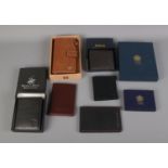 A collection of designer wallets and purses including Mulberry, Ralph Lauren, C. Collins & Sons.