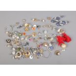 Over 60 pairs of costume jewellery earrings including tassels, snowflake and clip-on examples.