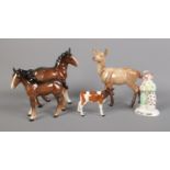 A collection of Beswick figures including Get Well Soon clown, foals, calf and deer.