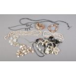 A collection of costume jewellery statement necklaces including shell and mother of pearl examples.