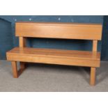 An oak paneled bench. Approx. dimensions 141cm x 83cm x 51cm.