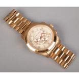 A Michael Kors gold tone chronograph wristwatch, with stainless steel bracelet.