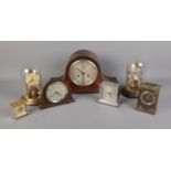 A box of assorted clocks including mantle, torsion and quartz examples.